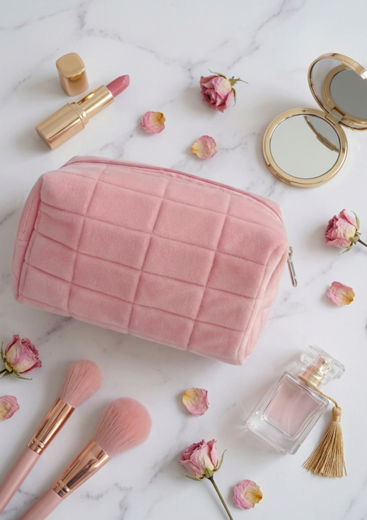 Purely Her Sanctuary Velvet Decompression Pillow Cosmetic Bag in pink with makeup brushes and perfume, flat lay